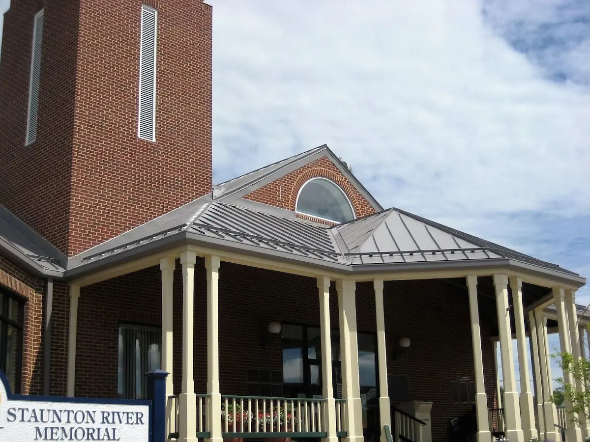Skilled roofing craftsmen working on a residential roof in Greenwood
